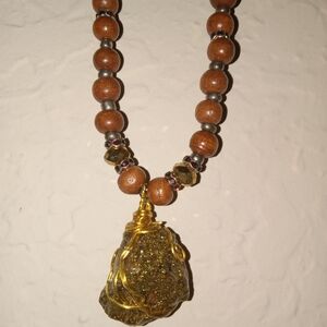 Pyrite gem on a beaded necklace